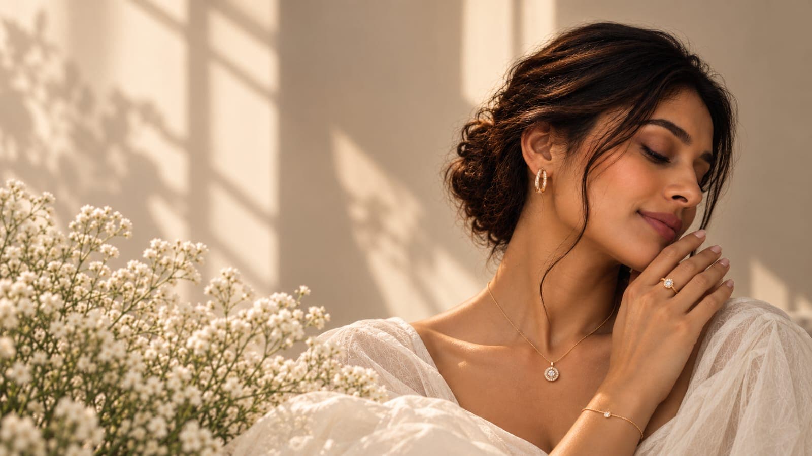 Model wearing gold earrings, a necklace, ring and bracelet from 100triangles London